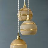 Suspension triple vintage glass globes in frosted yellow and gold.