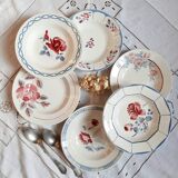 Mismatched old soup plates accompanied by a soup tureen