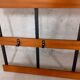 Wall coat rack in teak and vintage black metal