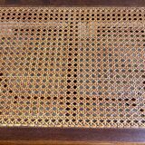 Piano bench in dark wood and cane