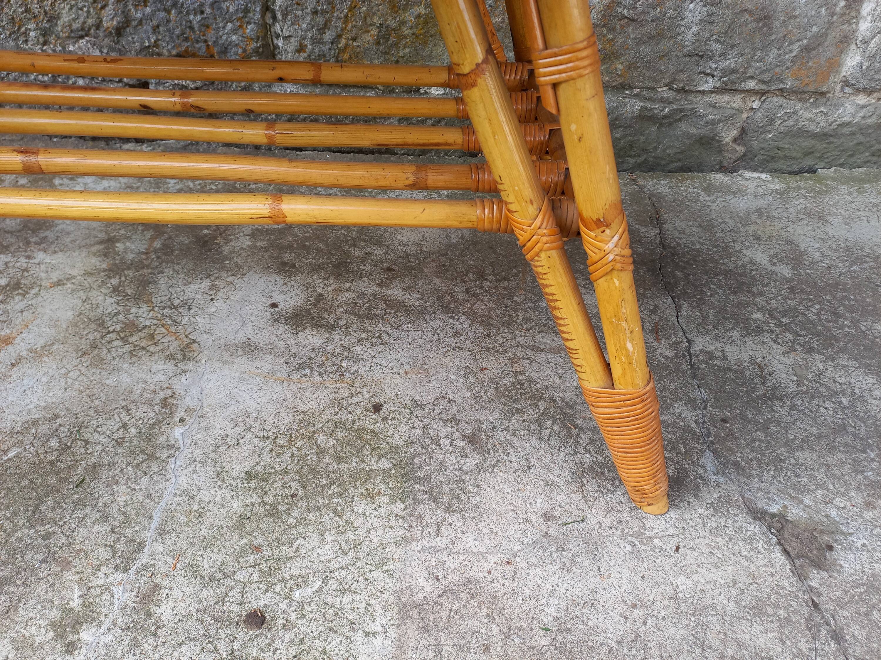 Rattan coffee table with compass legs