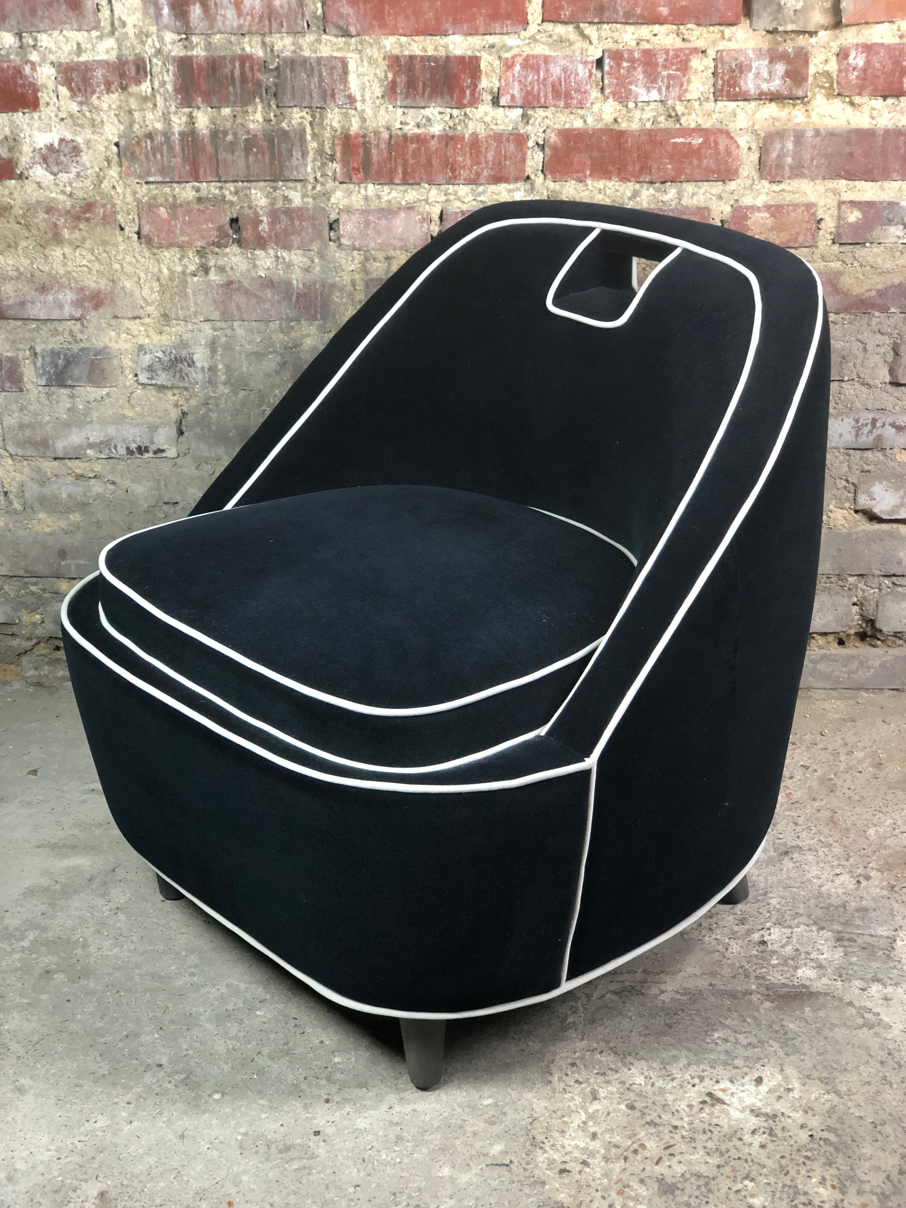 Retro vintage 80's armchair in black velvet with white trim