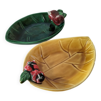 Two relief bowls with leaf designs, radishes, and tomatoes.