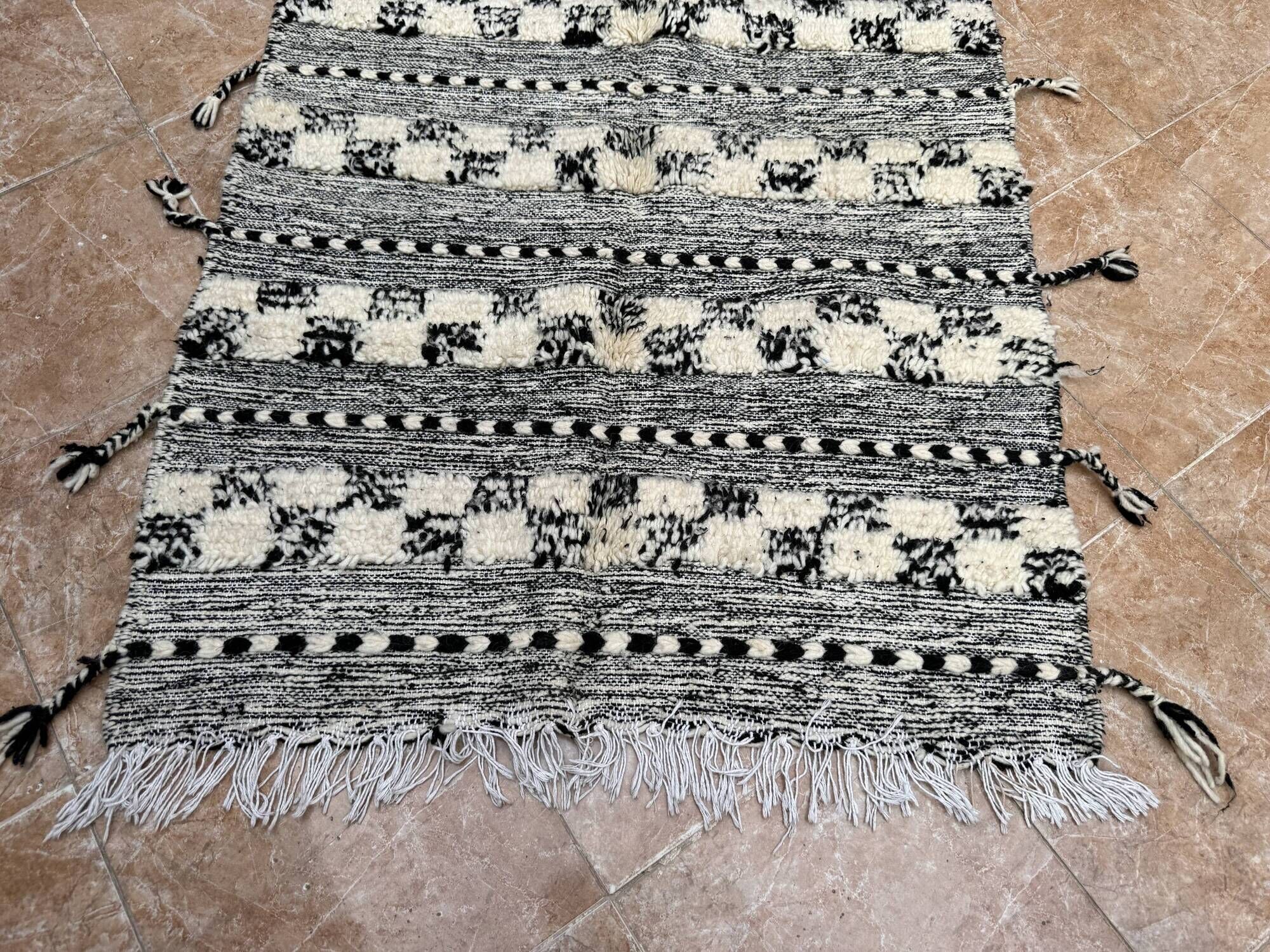 Small black Moroccan Berber Zanafi kilim rug for bedroom and living room.