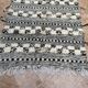 Small black Moroccan Berber Zanafi kilim rug for bedroom and living room.