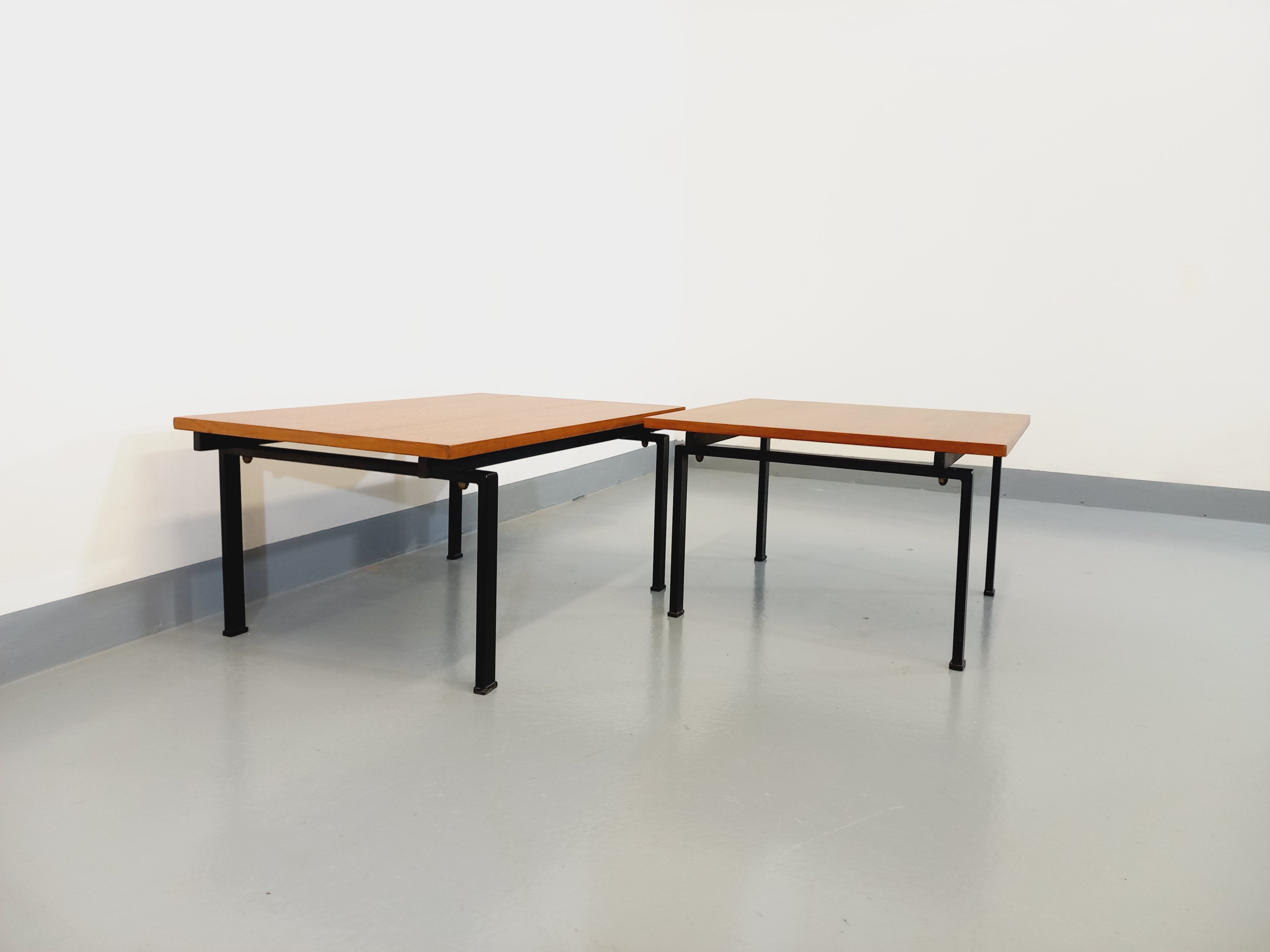 Suite of two vintage modernist Isa coffee tables in teak and black metal from the 60s
