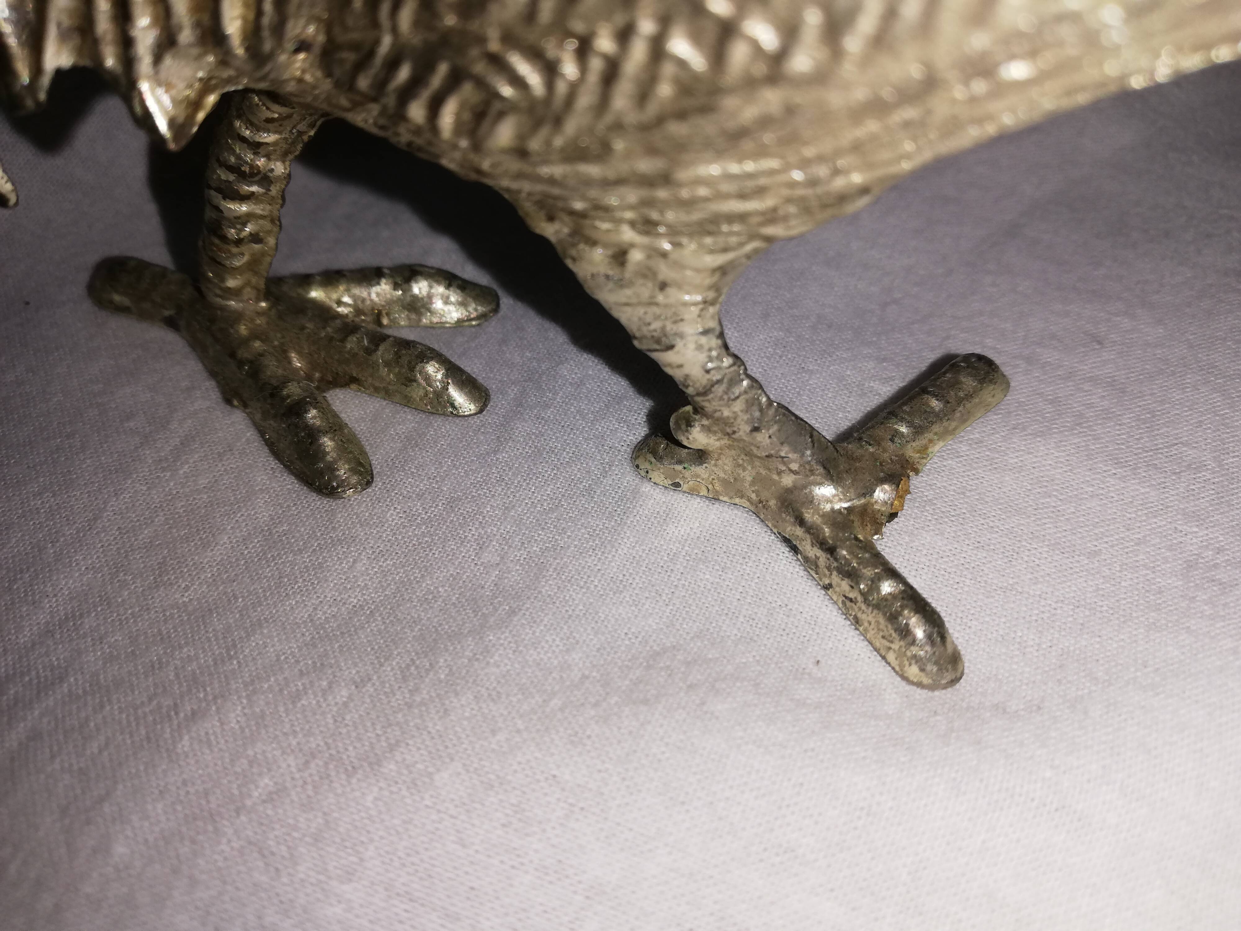 Silver metal peacocks couple