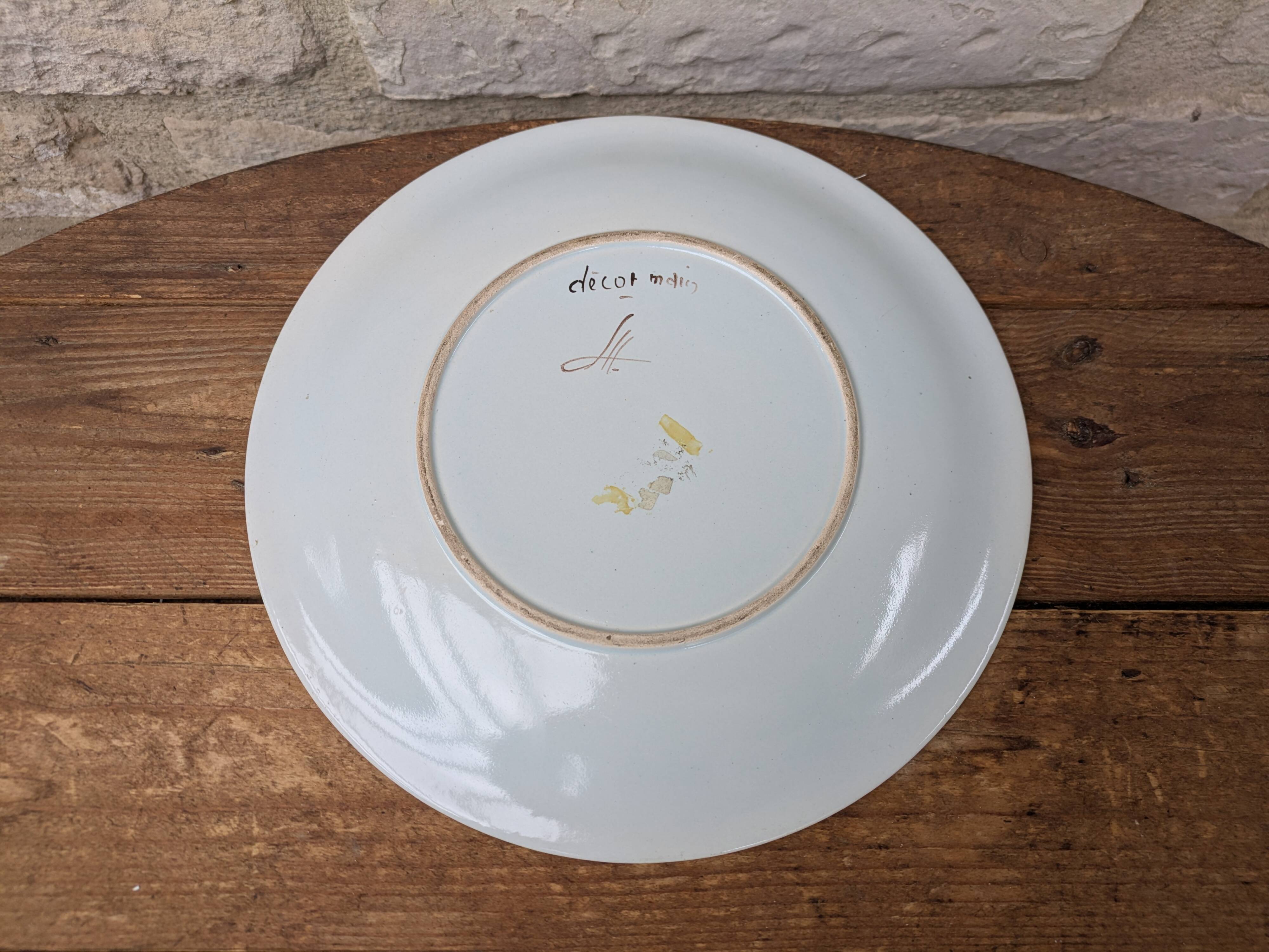 Plate with hand-painted flower bouquet on light blue background 25cm