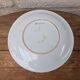 Plate with hand-painted flower bouquet on light blue background 25cm