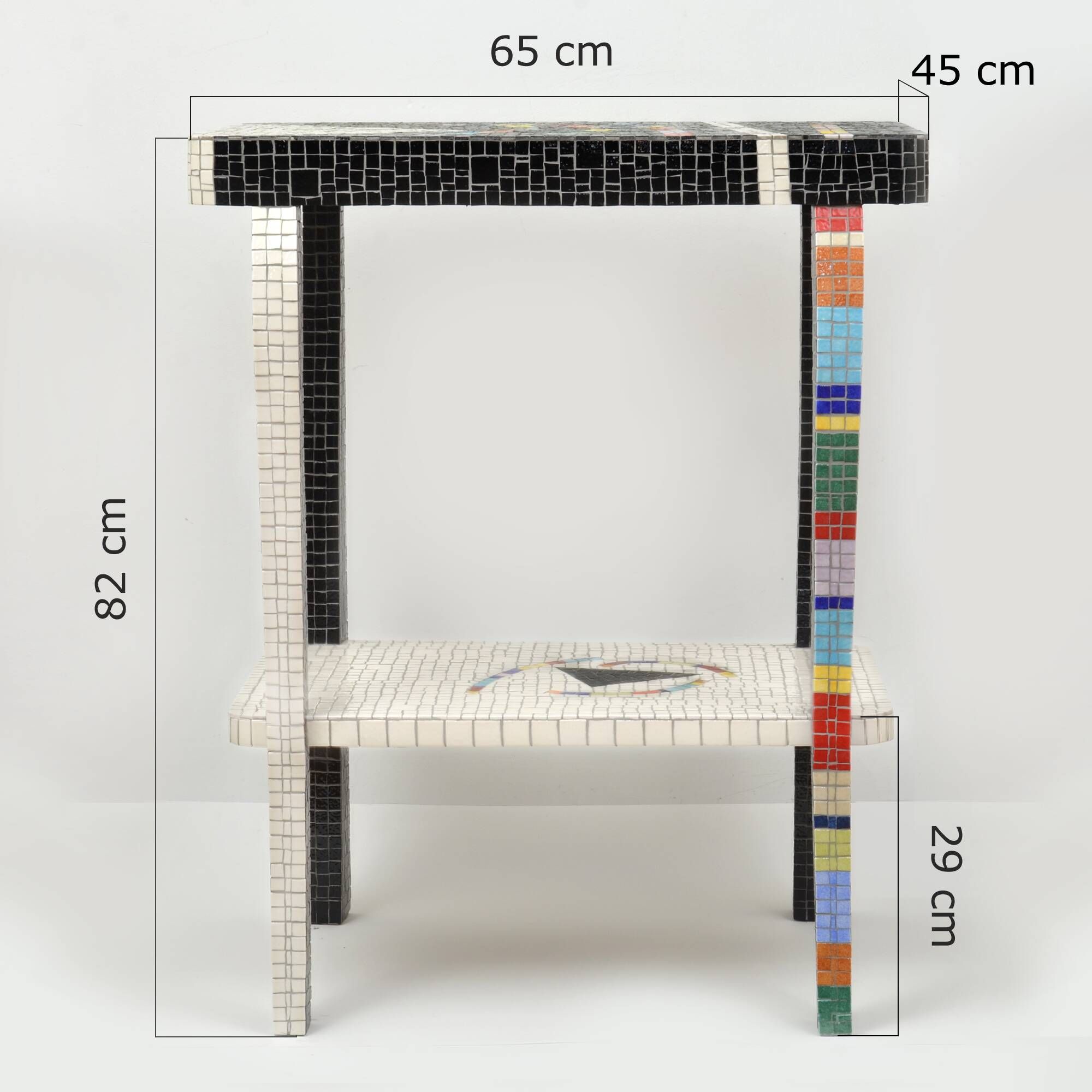 Table topped with a ceramic mosaic featuring an abstract design.