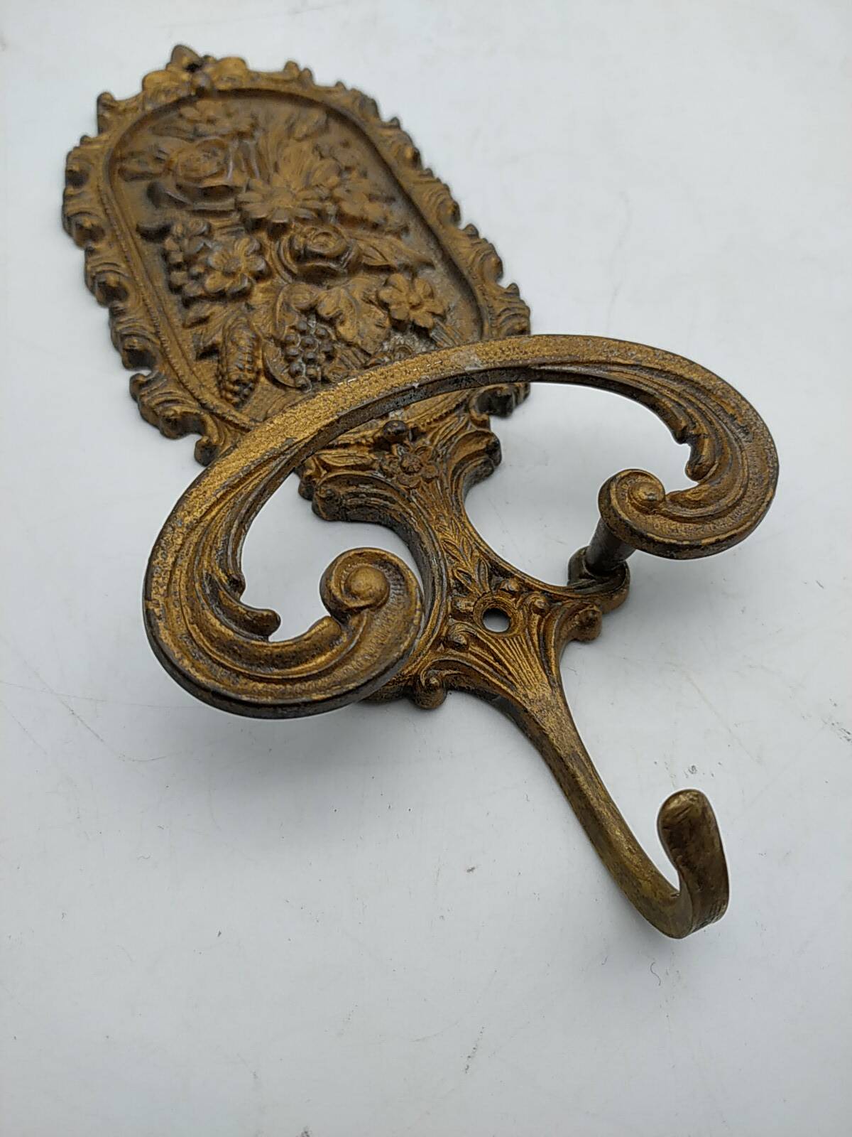 Brass coat rack with floral decoration