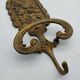Brass coat rack with floral decoration
