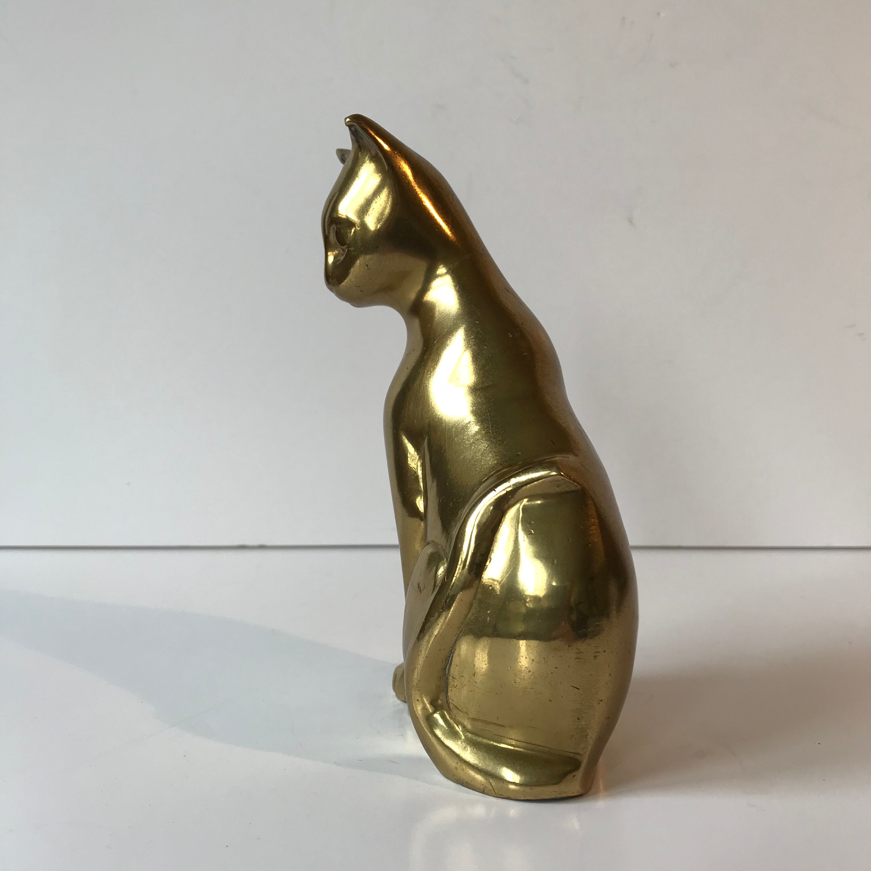 Cat in brass