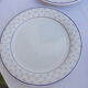 Set of 4 white and blue dinner plates.