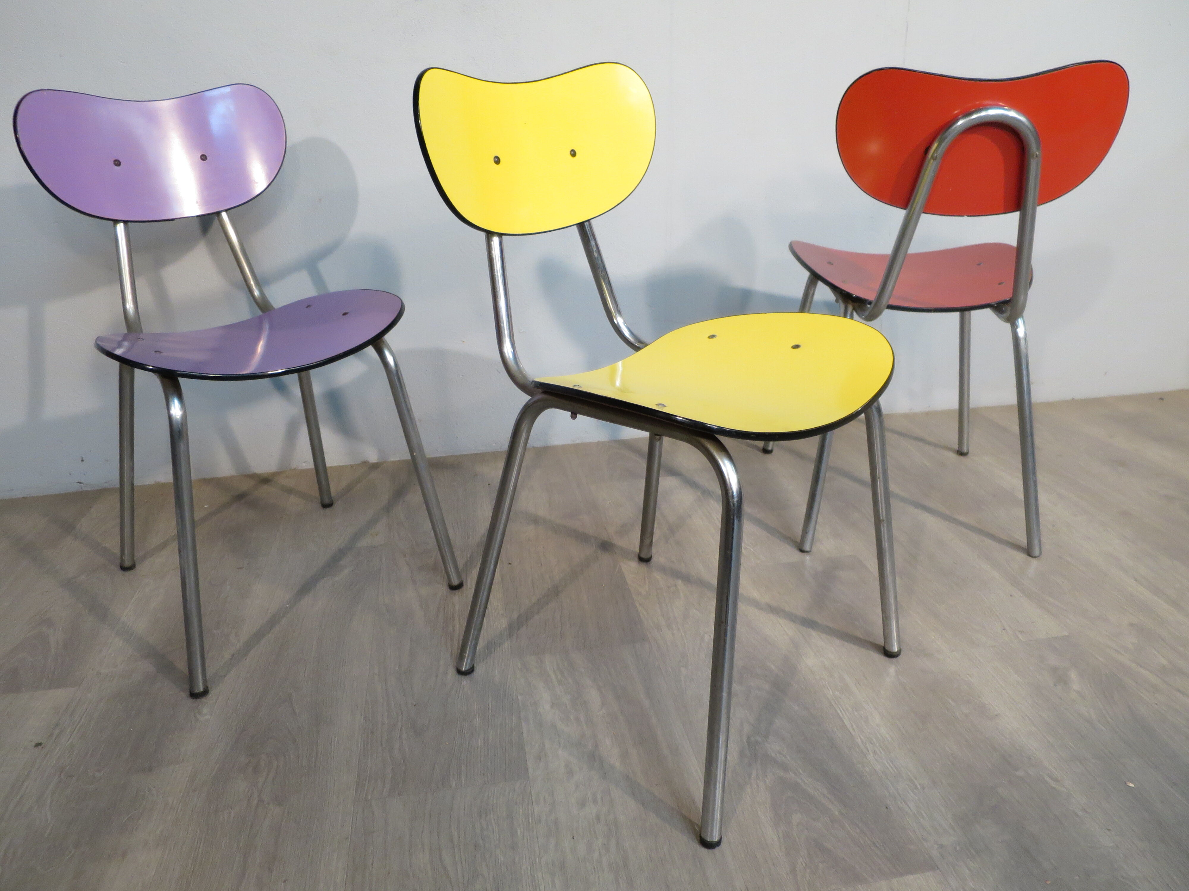 3 colored formica chairs