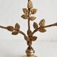 Antique bronze and brass candlestick with golden leaves