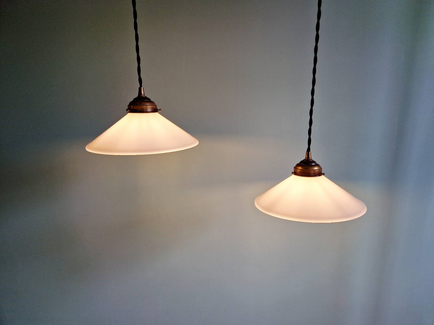 Pair of Art Deco conical white opaline pendants, 1920-30.