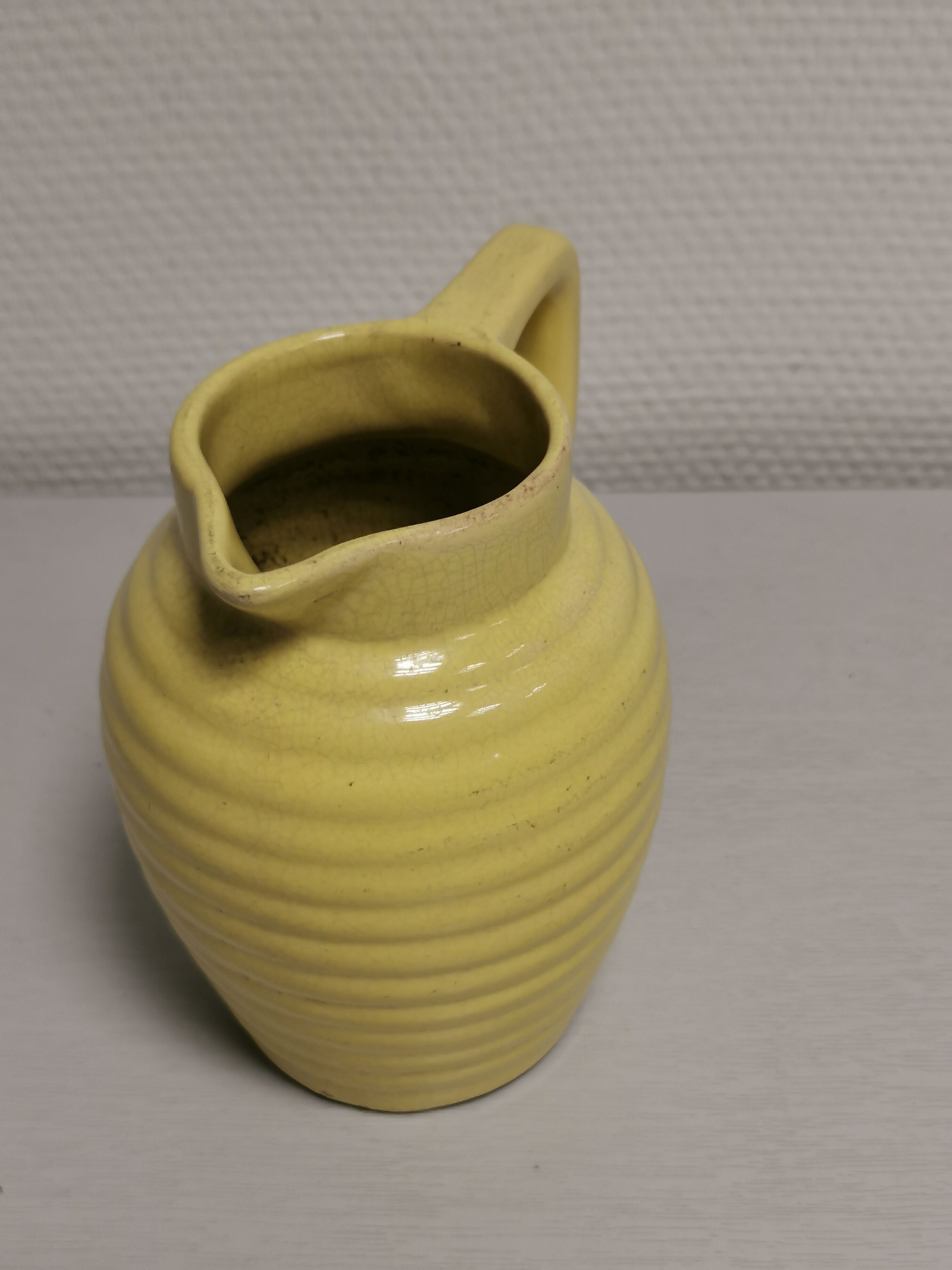 Yellow pitcher in slurry, faience onnaing frères