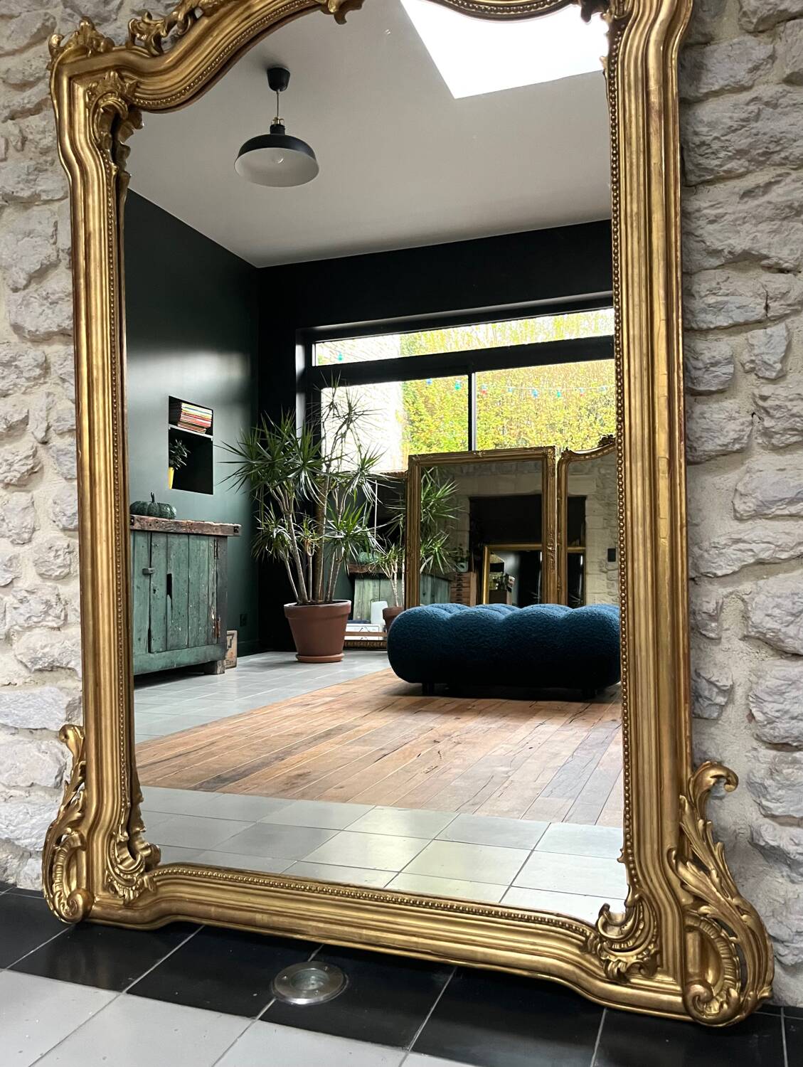 Antique mirror 169/105cm with pediments and pearl detailing in gold leaf.