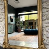 Antique mirror 169/105cm with pediments and pearl detailing in gold leaf.