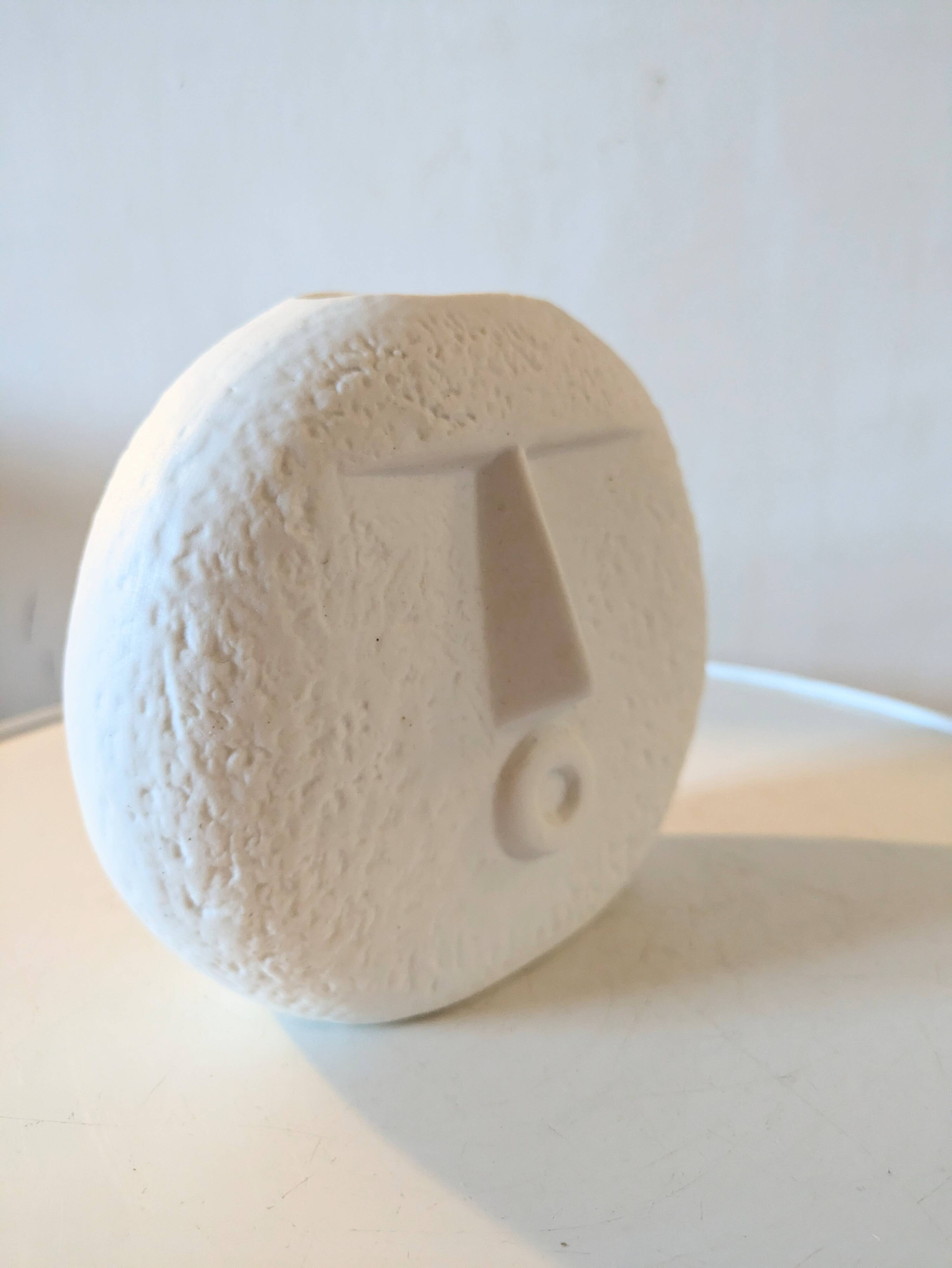 Stylized face biscuit vase