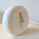 Stylized face biscuit vase