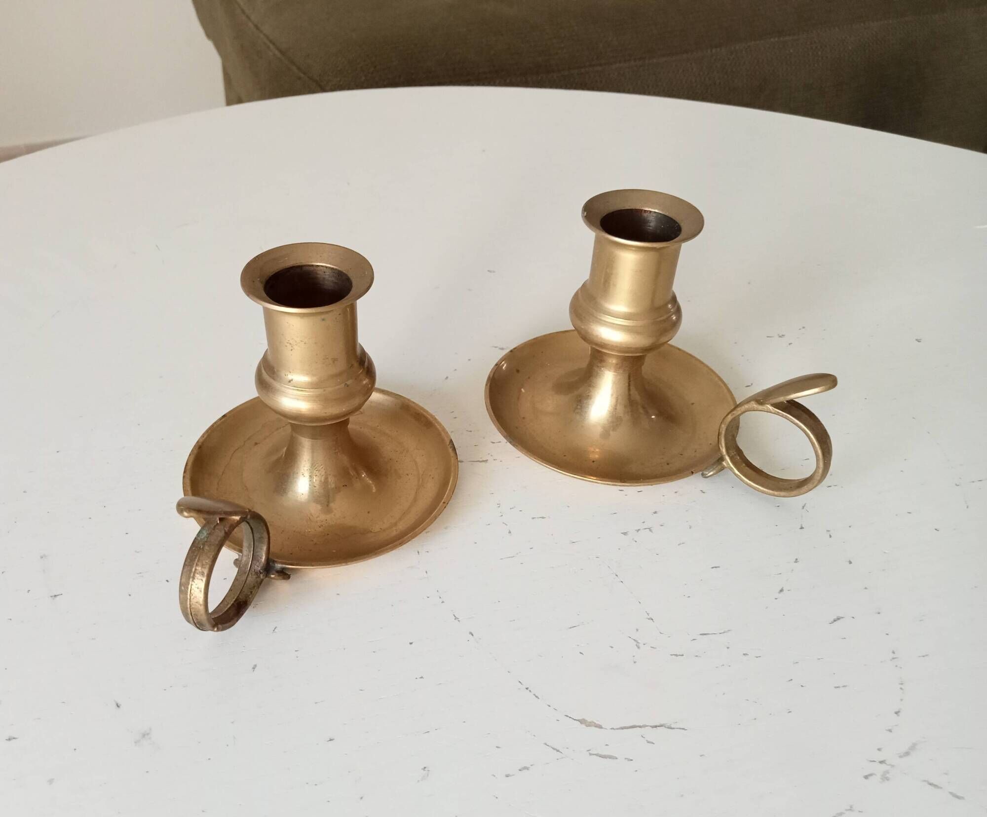Antique hand candlestick in solid gilded brass.