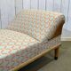 English daybed from the early 20th century in oak, some stains on the fabric