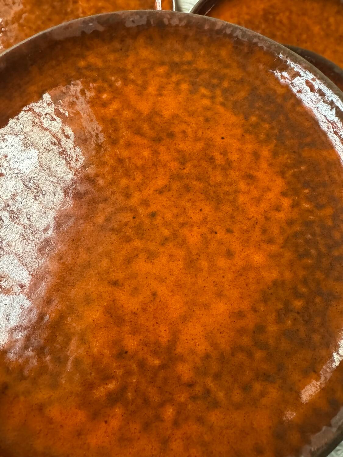 Orange glazed ceramic plates from the 1970s