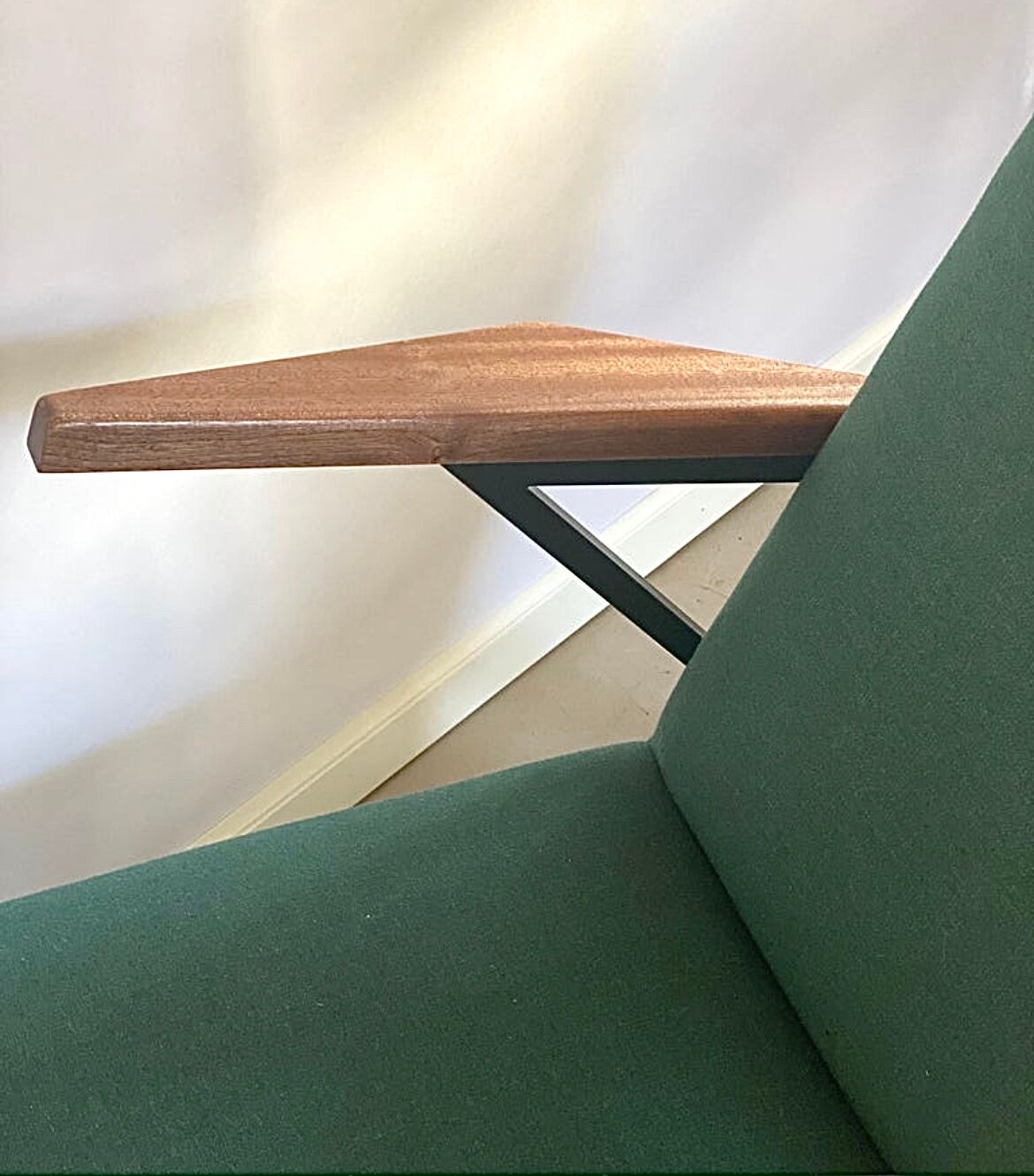 Lounge or easy chair with armrests