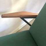 Lounge or easy chair with armrests