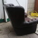 Padded chesterfield leather armchairs