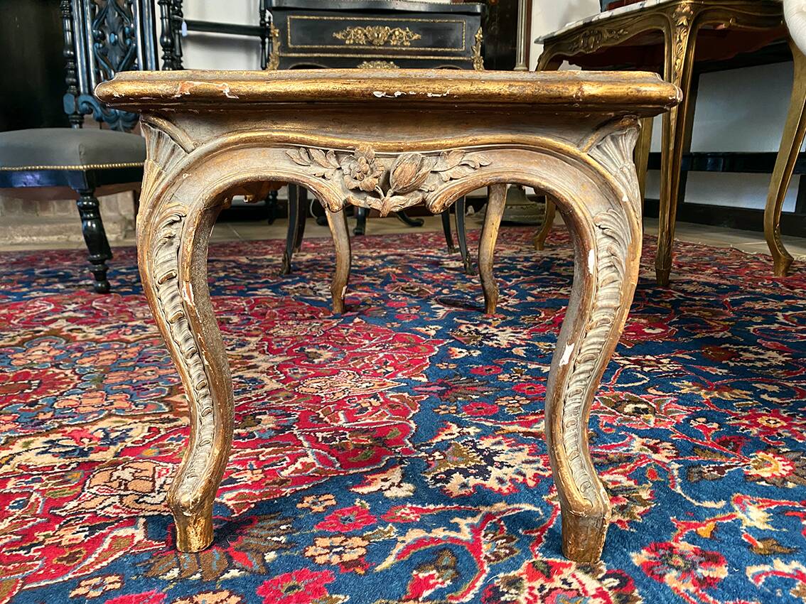 Louis XV style coffee table in carved wood with grey and gold highlights.