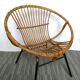 Rattan armchair and 1960s metal feet