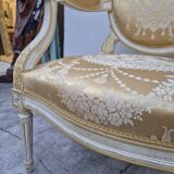 Louis XVI style cabriolet armchair with decorated medallion
