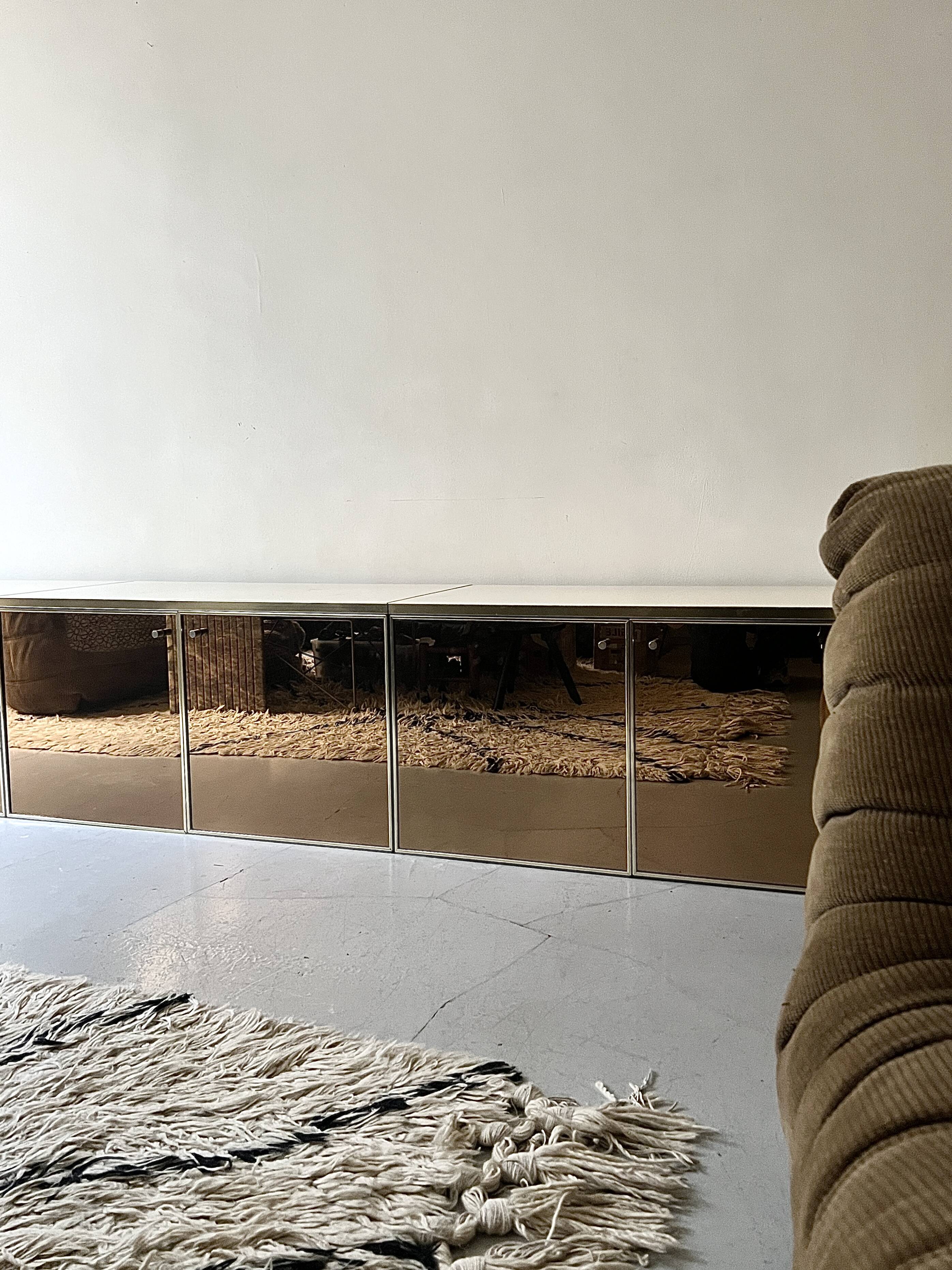 Low ivory lacquered enfilade, smoked mirror & brass JC Mahey, design 1970.