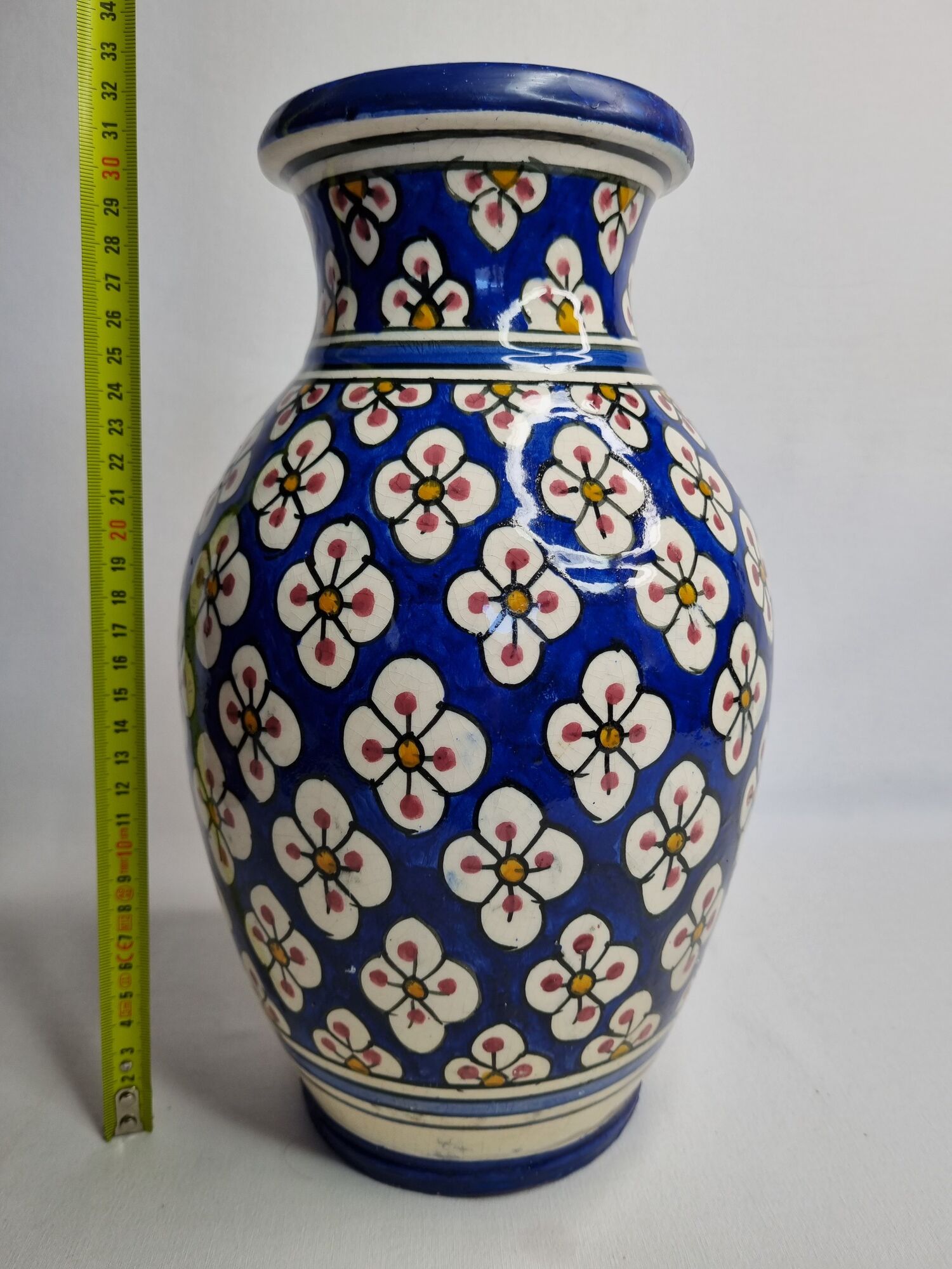 Moroccan handicraft vase in blue enamelled terracotta decorated with flowers, 32 cm