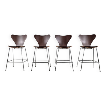 Set of 4 brown oak plywood bar stools by Fritz Hansen Series 7 by Arne Jacobsen.