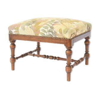 Stool trimmed with a floral fabric