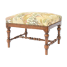 Stool trimmed with a floral fabric