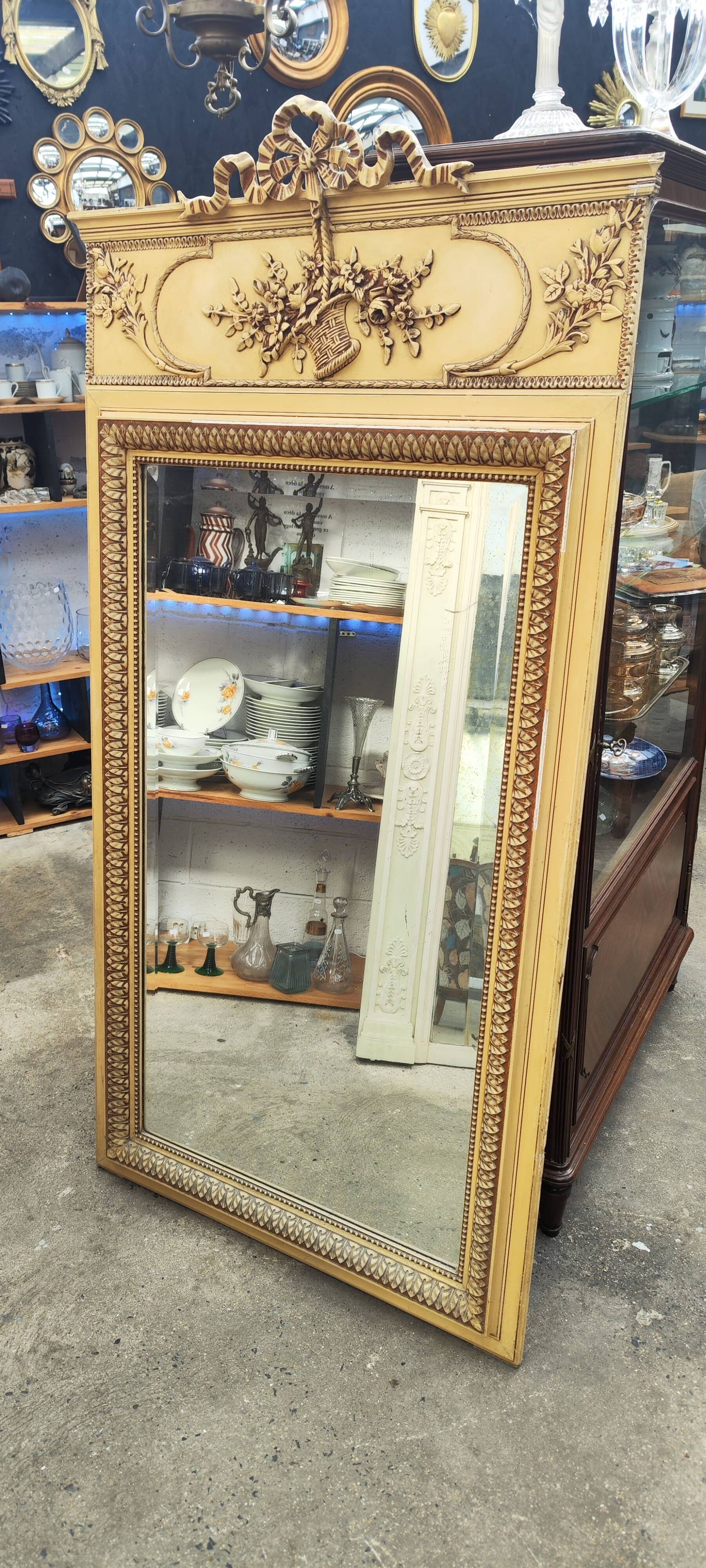 Old large Louis XVI style trumeau mirror with pediment and floral basket knot