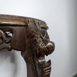 Carved selette with chimera decoration