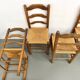 Set of 8 chairs in solid elm with straw seats.