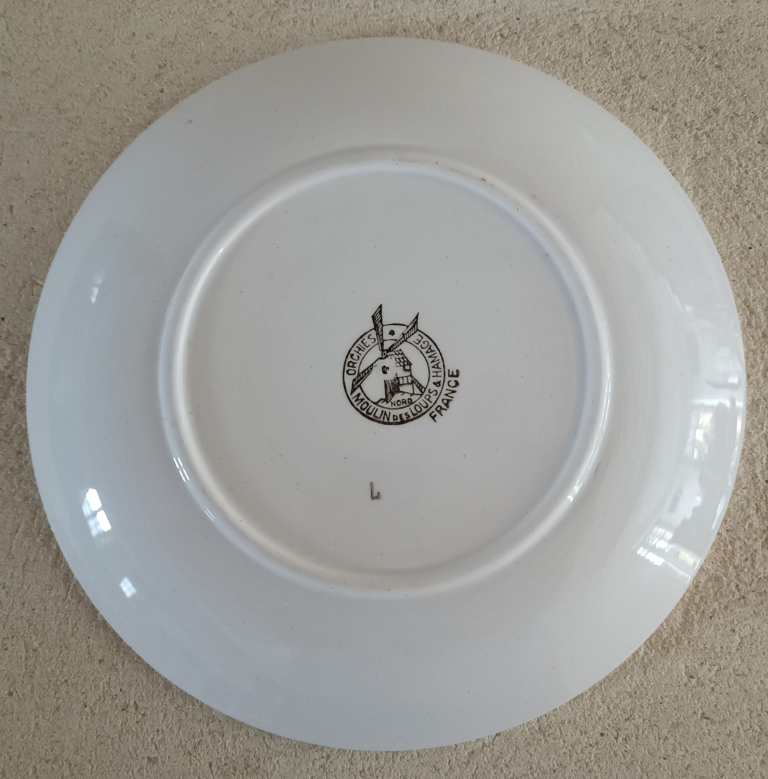 Plate iron earth decoration of Breton ringer Orchies Moulin des Loups