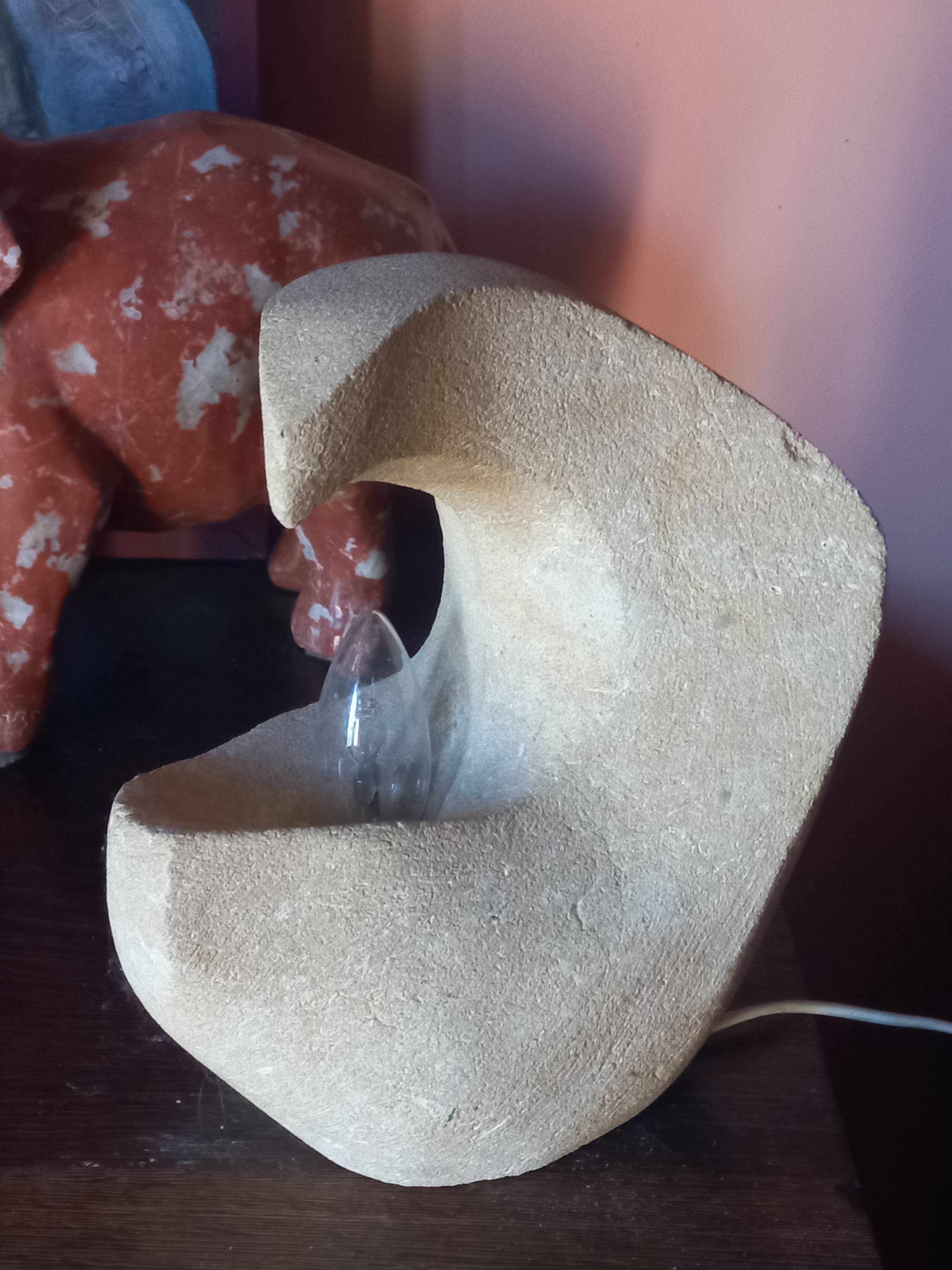 Sculpted stone lamp from the 1970s, signed.