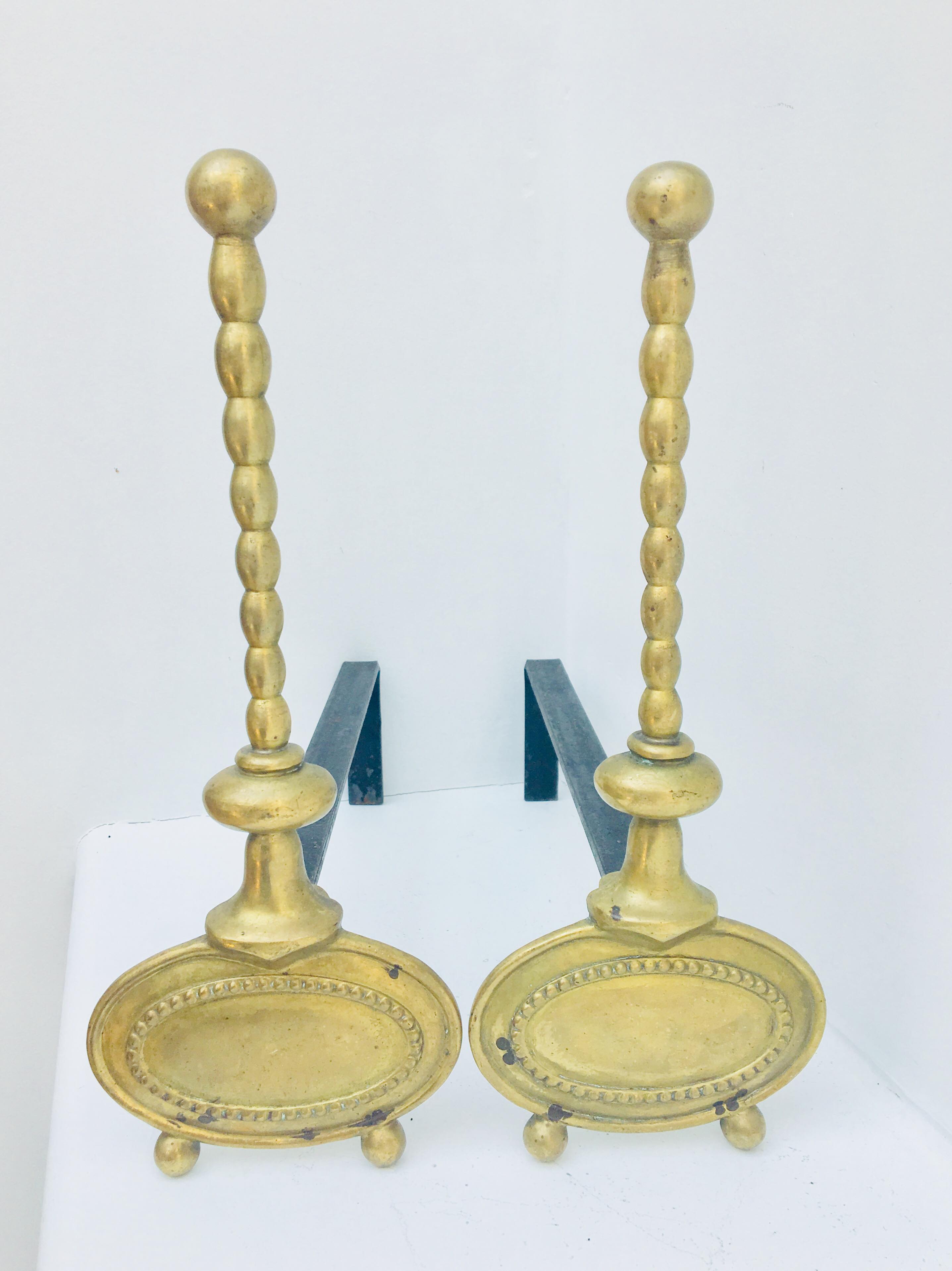 Pair of andirons in brass for fireplace