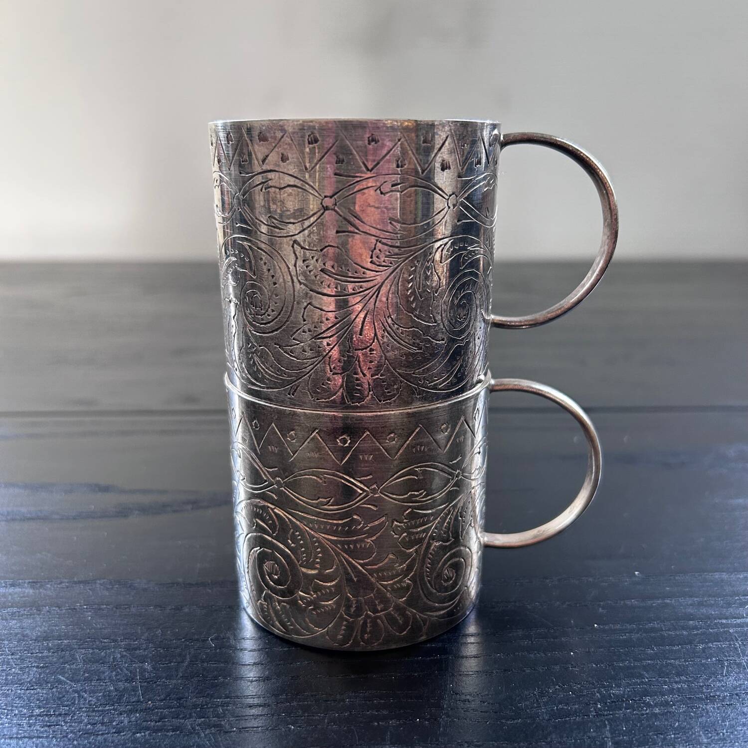Pair of chiseled silver cups