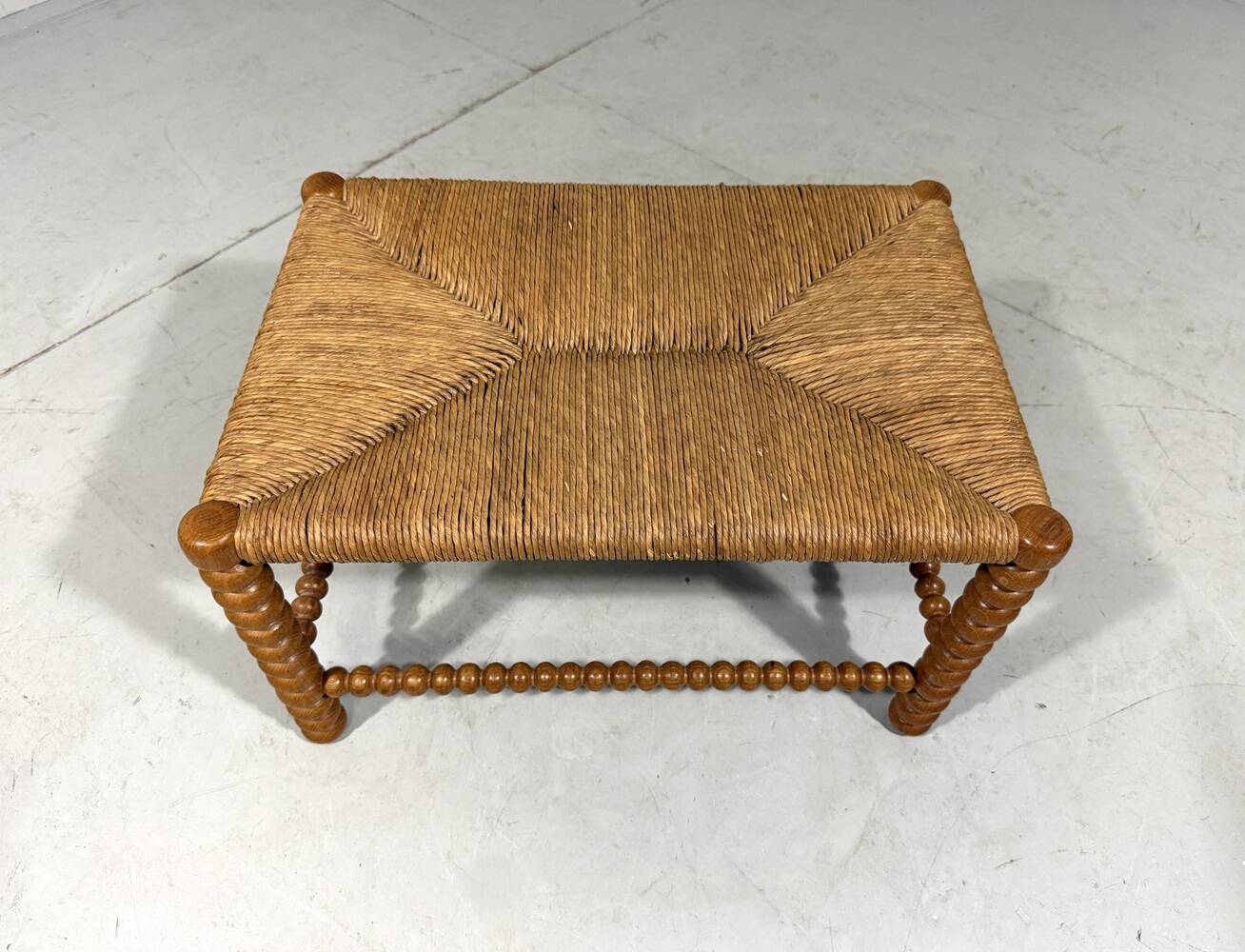 Low oak bobbin stool with rush seat 1930’s