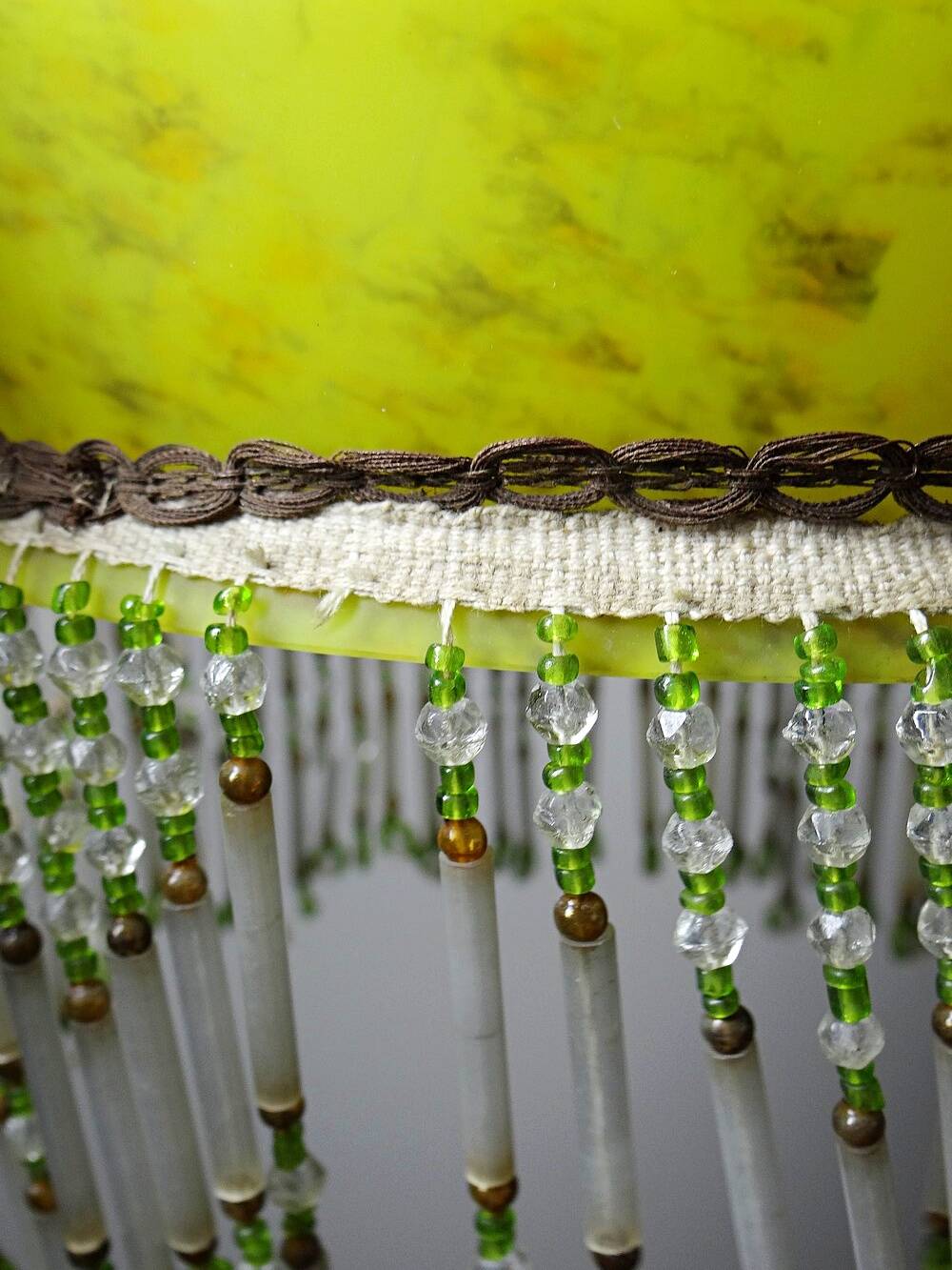 Antique Art Deco lampshade in yellow marbled glass with bead fringes.