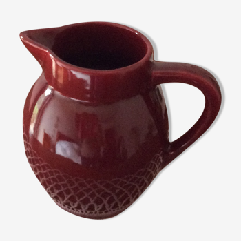Old dark red ceramic pitcher jug